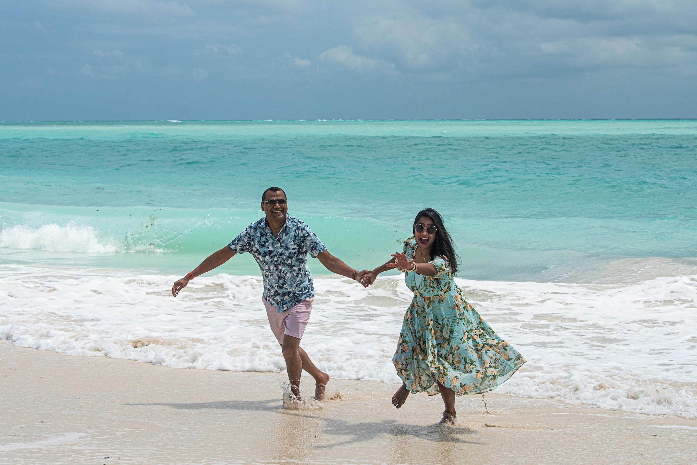 A lovers couple walking at a beach at the Mexican Caribbean