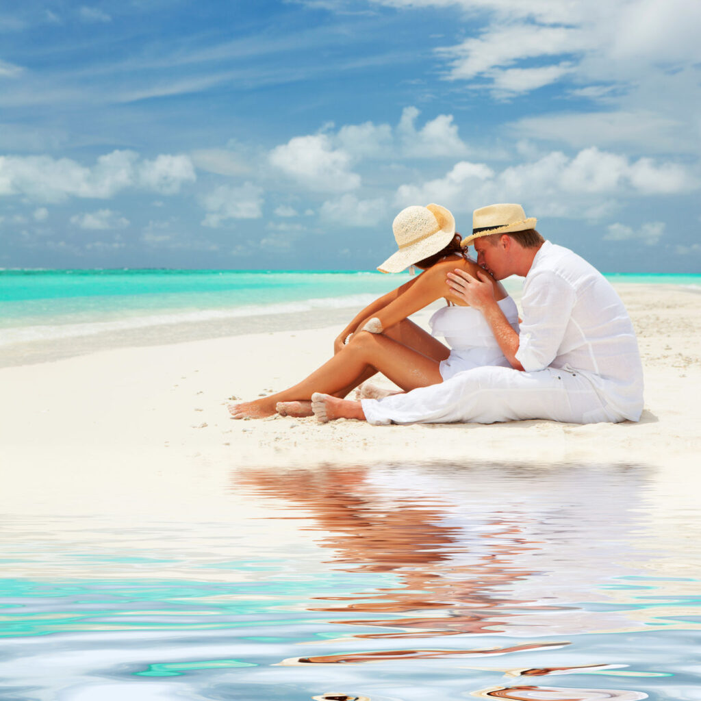 A engaged couple at the beach